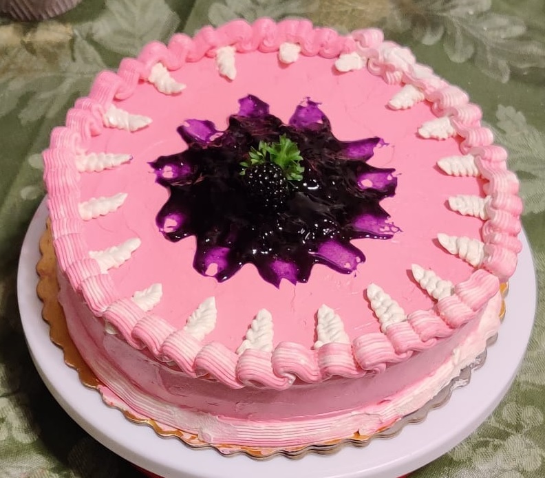 Cake with a blackberry glaze and filling